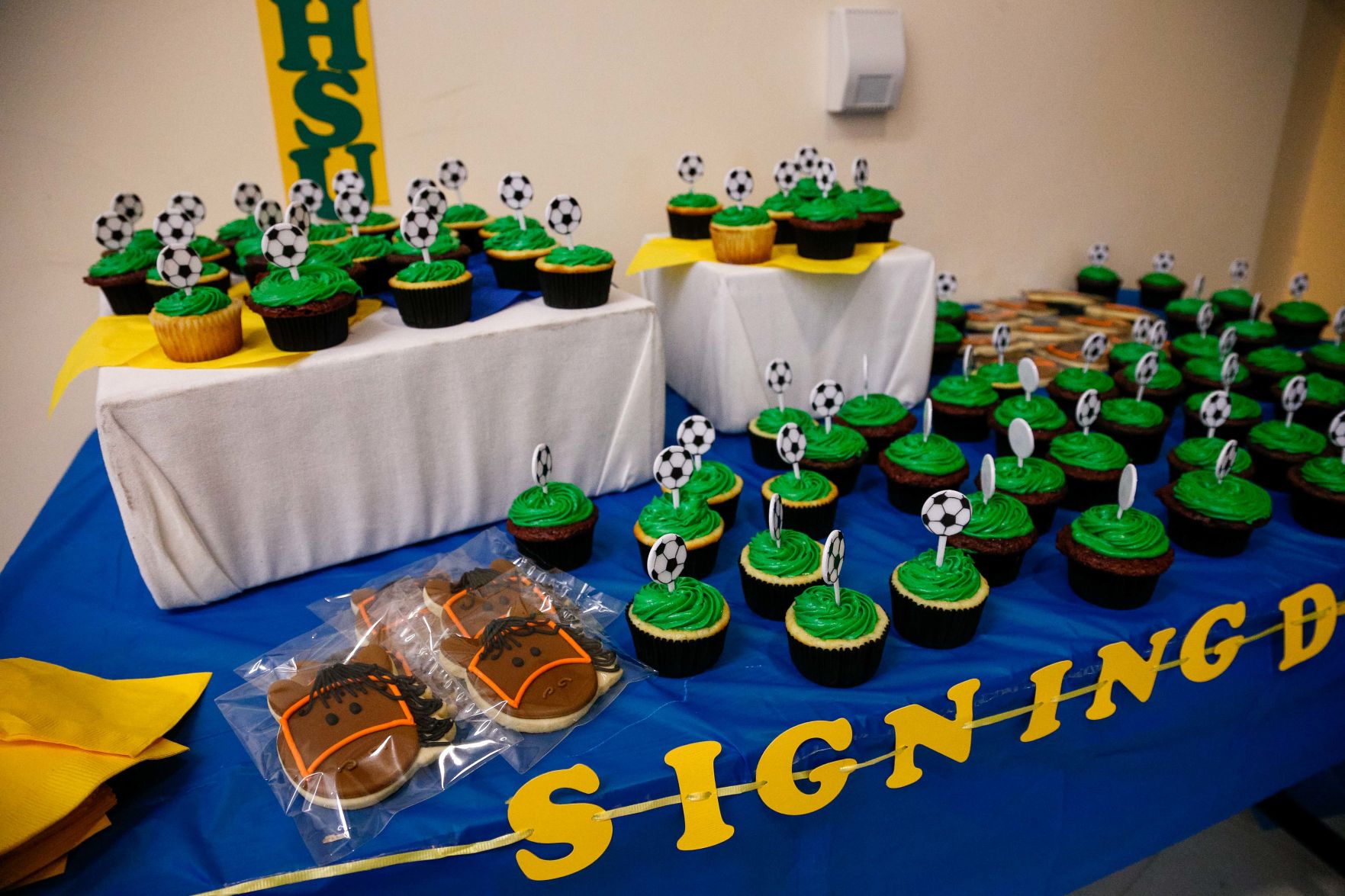 SIGNING DAY: Rampart athletes sign their National Letter of Intent